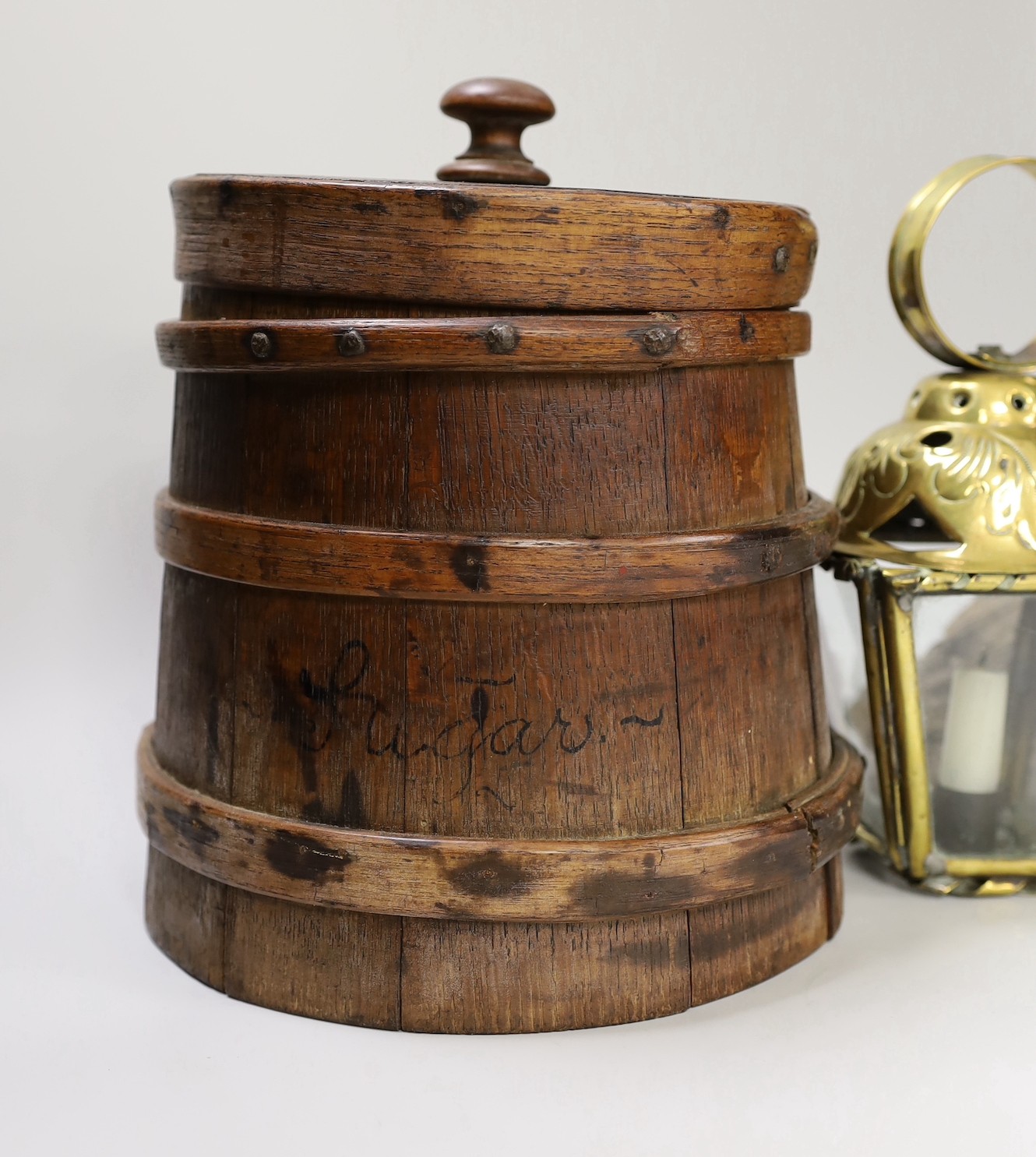 An oak grain measure, a 17th century oak rosette boss and ceiling pendant candle lantern